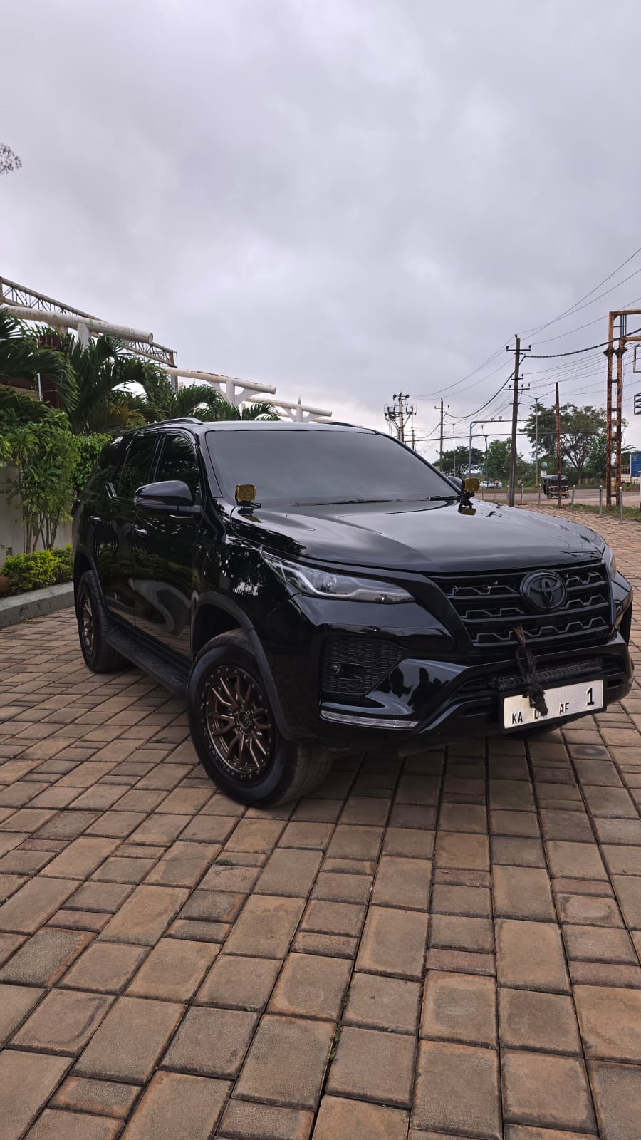 Black Tata vehicle under studio lights